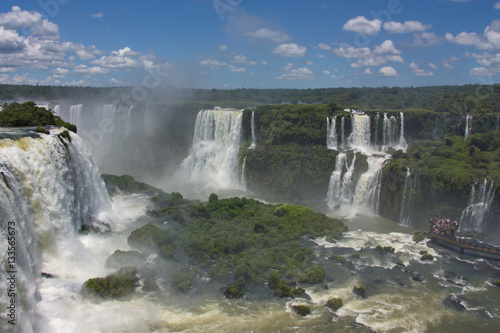 view of the Iguazu Falls and the observation deck with tourists from Brazil