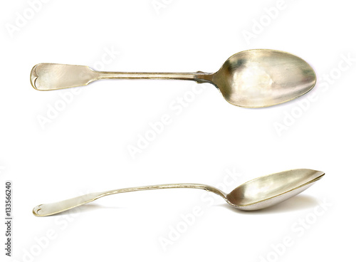 Old silver spoons (made in 1924) on white background