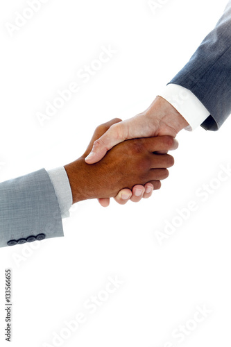 Close-up on a business handshake closing a deal between two businessmen