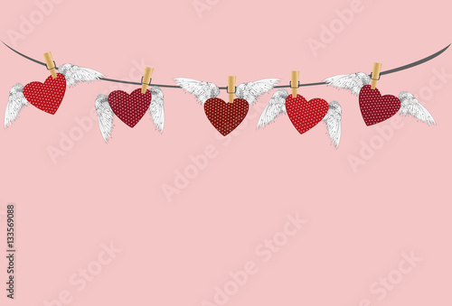 Five Red hearts with wings hanging on a rope. clothes pegs