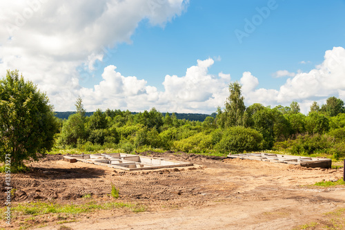 View of construction site and house foundation in preparation pr