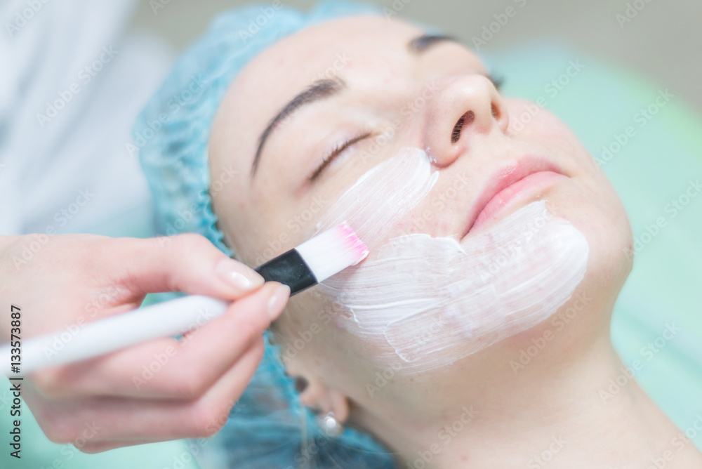 Young woman with clay facial mask. Young woman with clay facial mask.