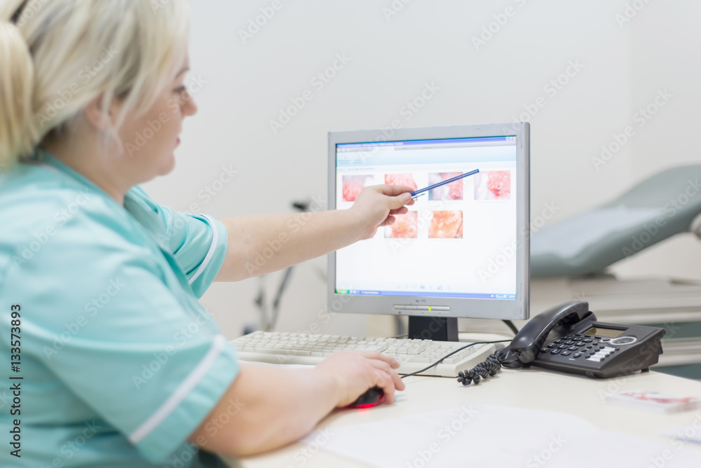 Two doctor female - discussing test reports that show on their s Two doctor female - discussing test reports that show on their s