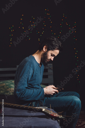 Tensed man using mobile phone