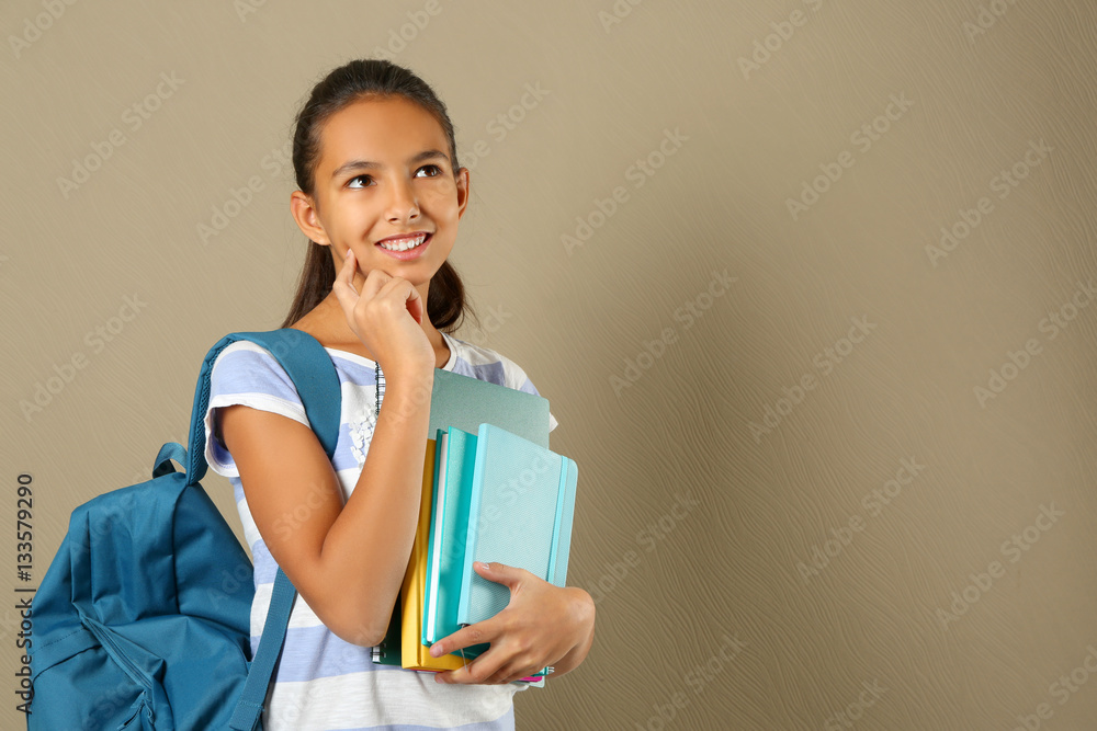 Cute schoolgirl on color background Cute schoolgirl on color background