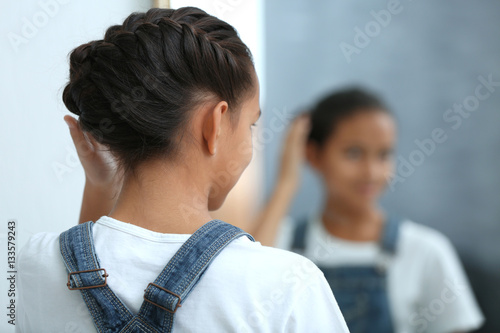 Cute girl looking in mirror...
