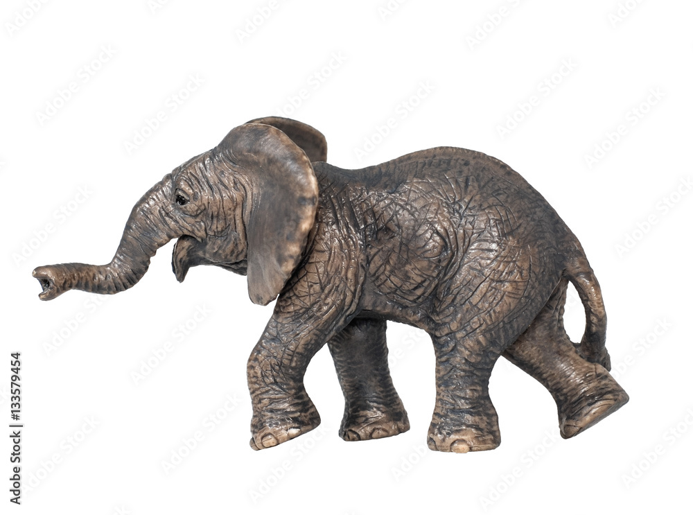 Toy elephant isolated on white background. Plastic toy elephant. Little  elephant walking isolated on a white background. The elephant is a symbol of the Republican Party.