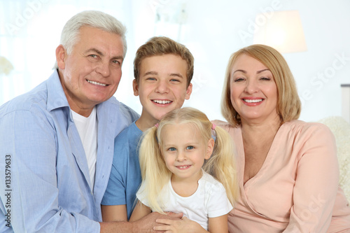 Cute children with grandpar...