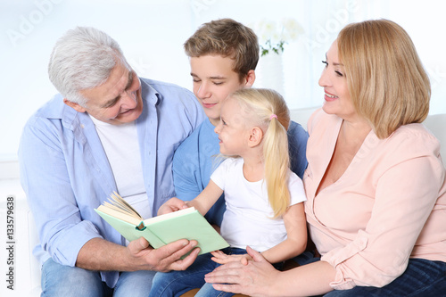 Cute children with grandpar...