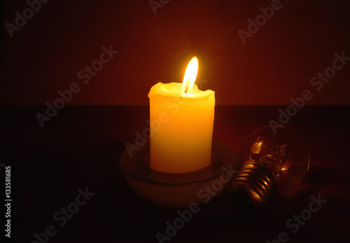 Obraz na płótnie Burning candle and lamp. Power outage. Missing electricity - blackout begin. Power outage. w salonie