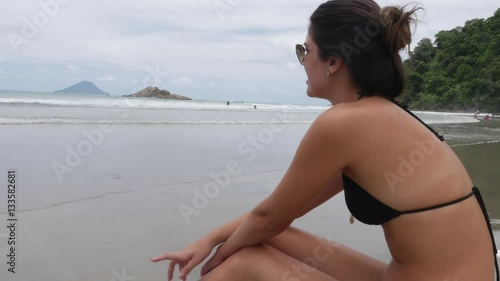 Brazilian Woman Relaxing on the beach photo