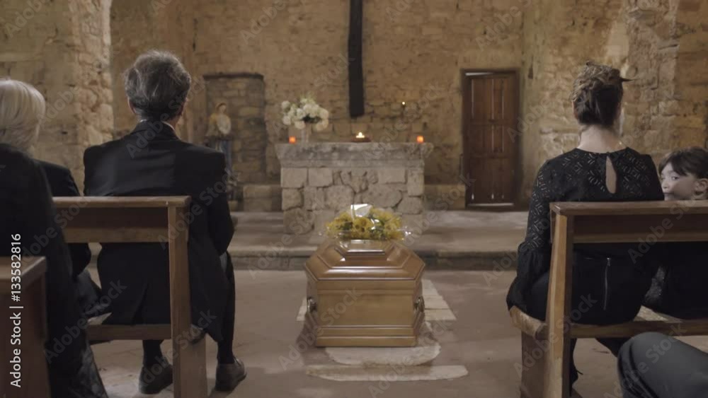 Mourners at funeral service in church Mourners at funeral service in church