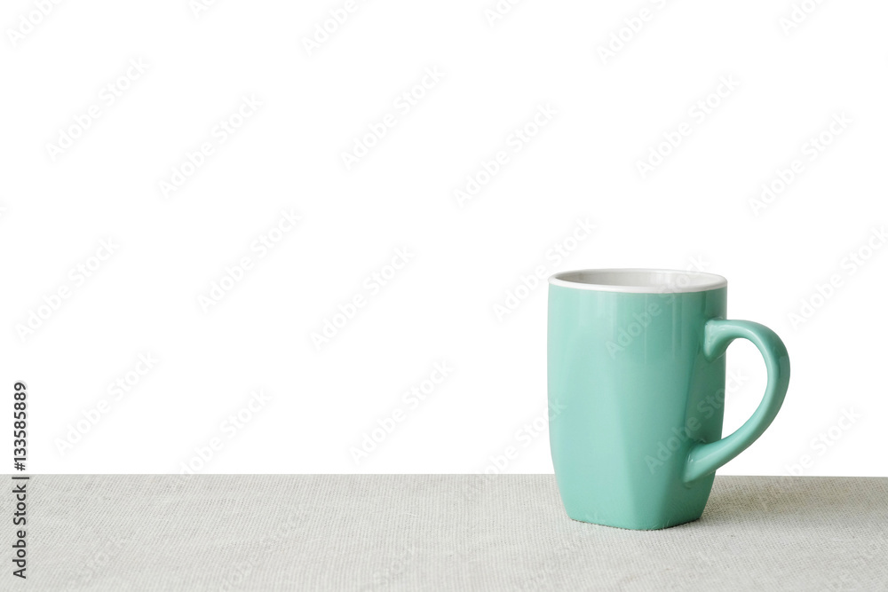 Green coffee cup on sack tablecloth isolated on white background Green coffee cup on sack tablecloth isolated on white background