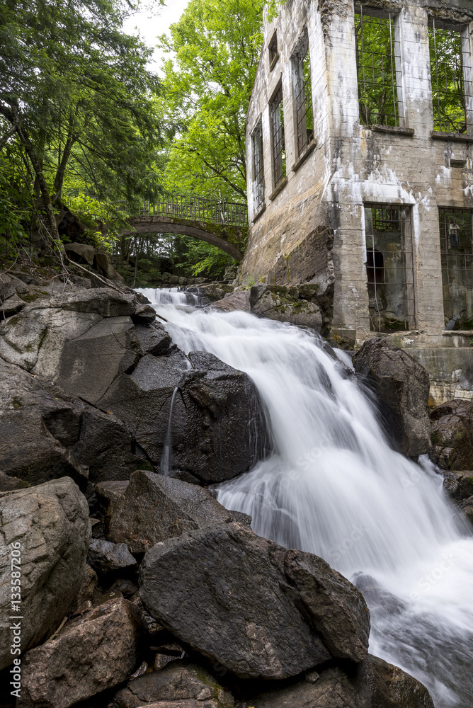 Ruins next to a waterfall in the forest Ruins next to a waterfall in the forest