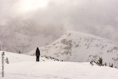 Female skier in mountains skiing powder © tslphoto