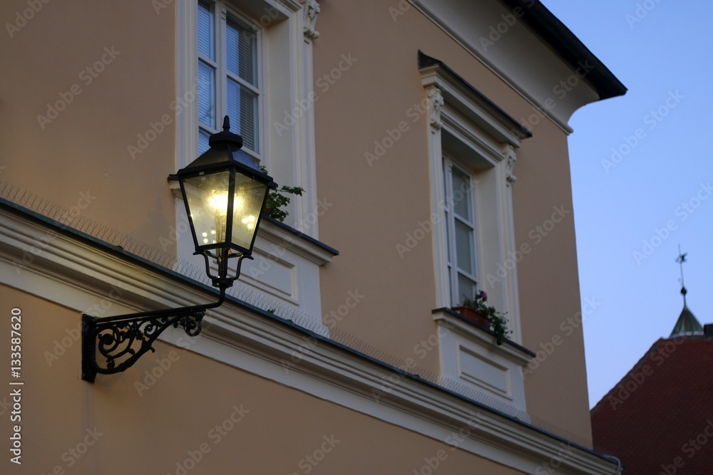 Retro lantern in Old Town, Zagreb, Croatia. Lit at dusk. Selective focus.