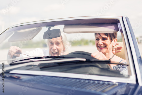 Senior Couple Driving A Convertible Classic Car © nullplus