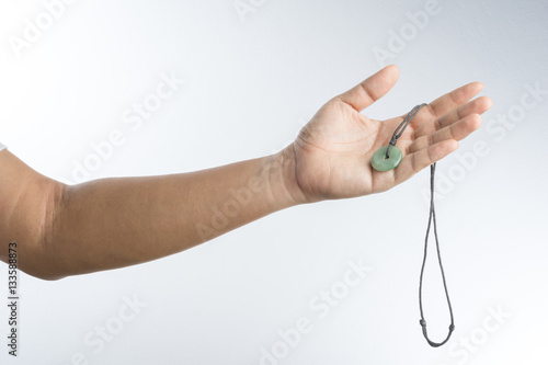 hand with jade necklace