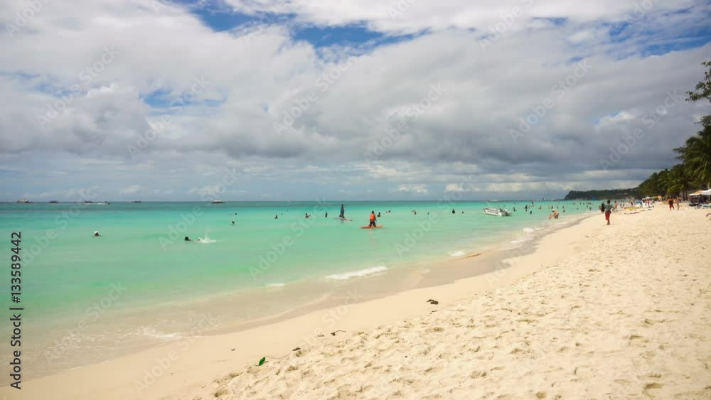Beach with tourists, sea, sand,wave. Tropical beach, blue sky, clouds. Seascape ocean and beautiful beach paradise. Philippines Boracay. 4K video Travel concept Beach with tourists, sea, sand,wave. Tropical beach, blue sky, clouds. Seascape ocean and beautiful beach paradise. Philippines Boracay. 4K video Travel concept