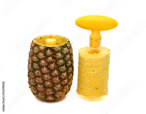 Obraz na plátně A pineapple has been cored and sliced using a corer and slicer utensil