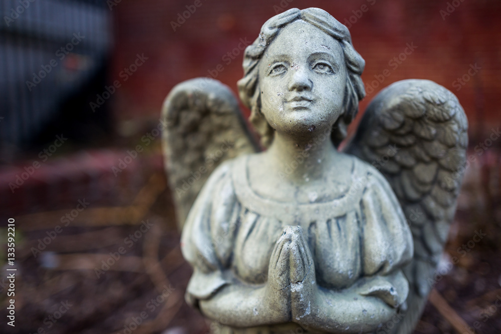 The stone angel prays
