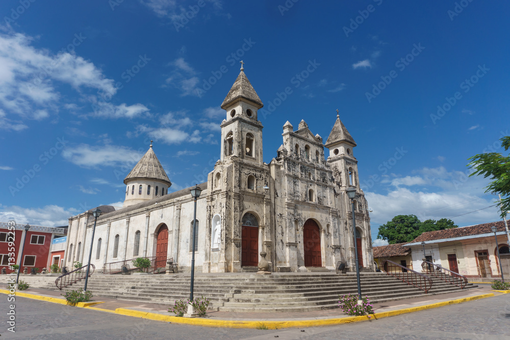 Granada, Nicaragua – December 21, 2016: Guadalupe Church view with la Calzada, the most touristic street in Nicaragua