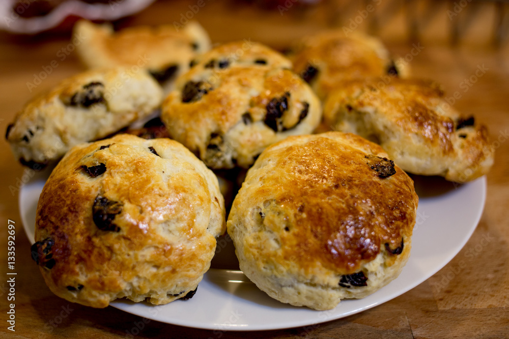 Traditional delicious British pastry and desert - scones with fresh raisin.Home baking.