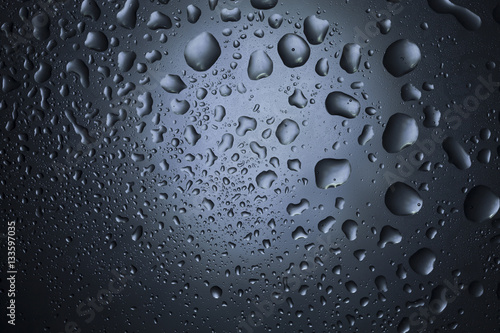 Water drops on dark wall and light, water drop for background 