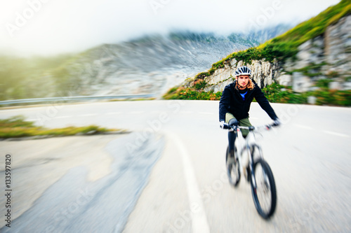 Fototapeta Naklejka Na Ścianę i Meble -  Young Man Cycling