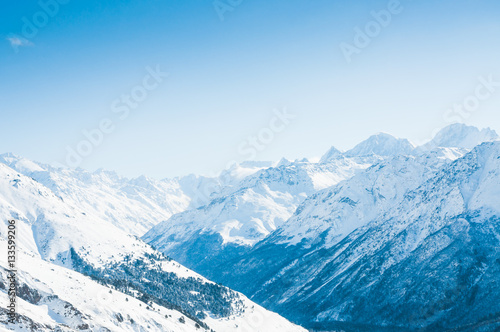 Snow-covered mountains and blue sky.