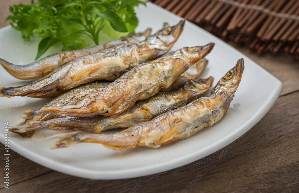Grilled fish capelin or shishamo on plate