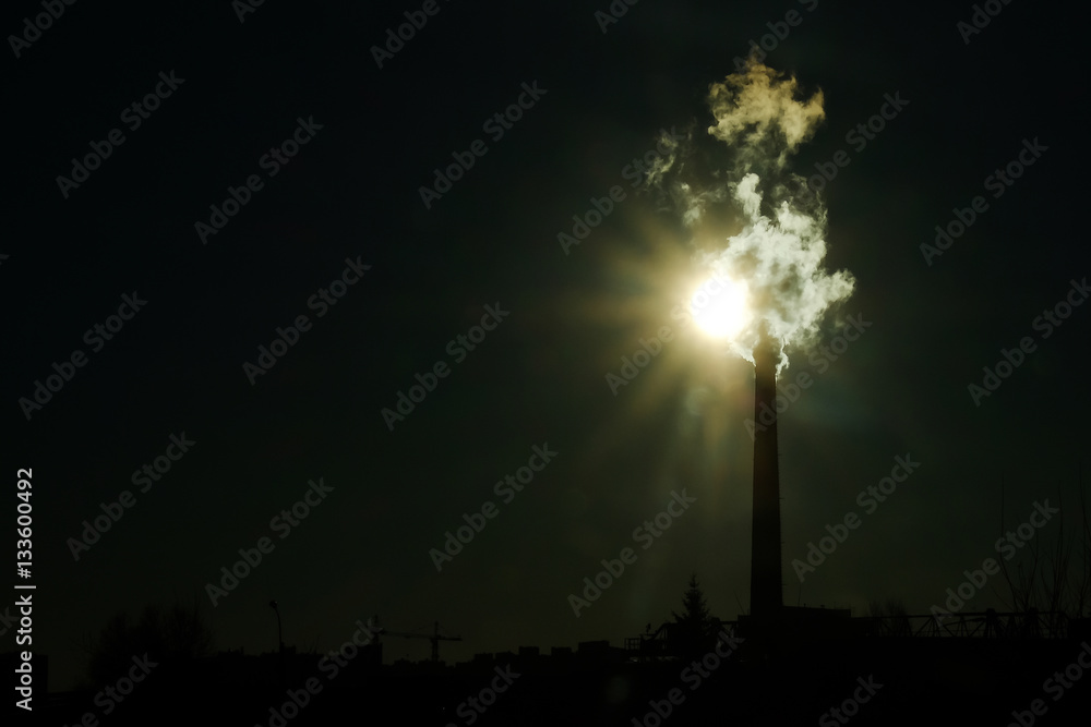 Fototapeta premium thick smoke belching from factory chimneys