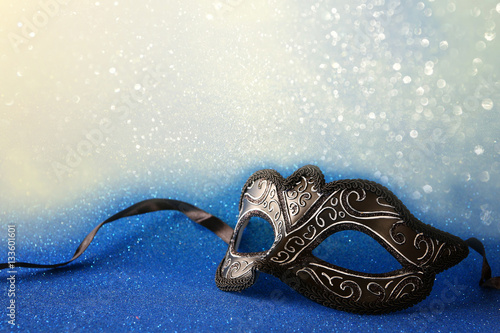 Obraz na plátně elegant venetian mask on blue glitter background