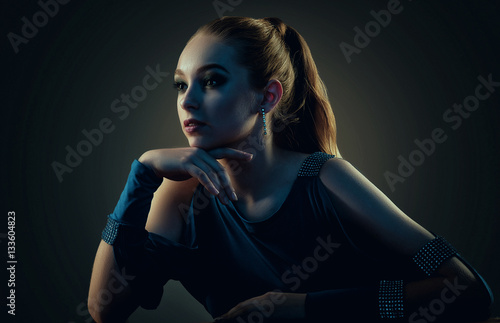 Low key portrait of a beautiful girl. Studio shot