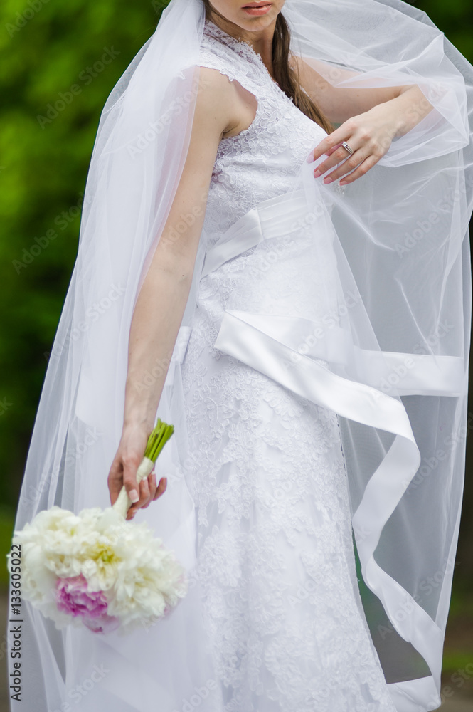 Beautiful bride with bouquet before wedding ceremony Beautiful bride with bouquet before wedding ceremony