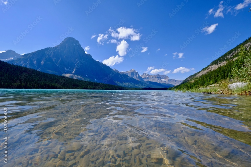 Blue lake and rocky mountains. Waterfowl lake. Canadian Rockies. Banff Natioanal Park. British Columbia. Canada. Blue lake and rocky mountains. Waterfowl lake. Canadian Rockies. Banff Natioanal Park. British Columbia. Canada.
