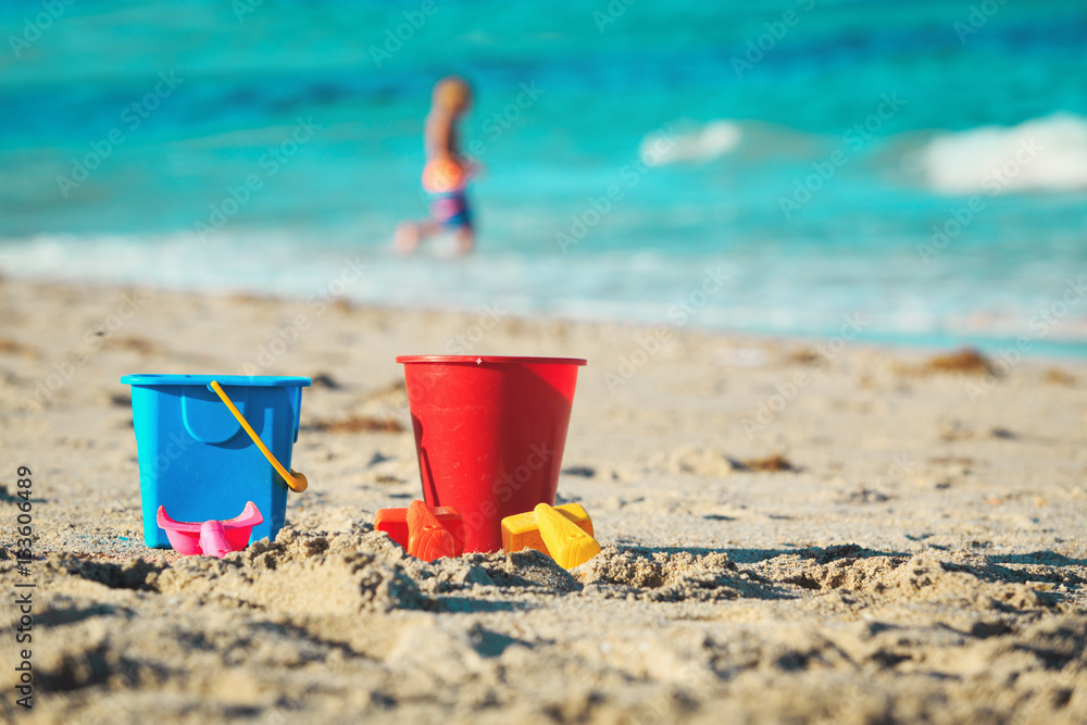 kids toys and little boy playing on the beach kids toys and little boy playing on the beach