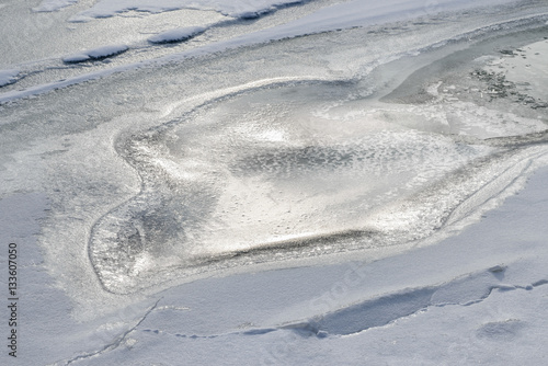 Frozen ice texture and snow on the Dnieper river in Kiev, Ukraine, during winter