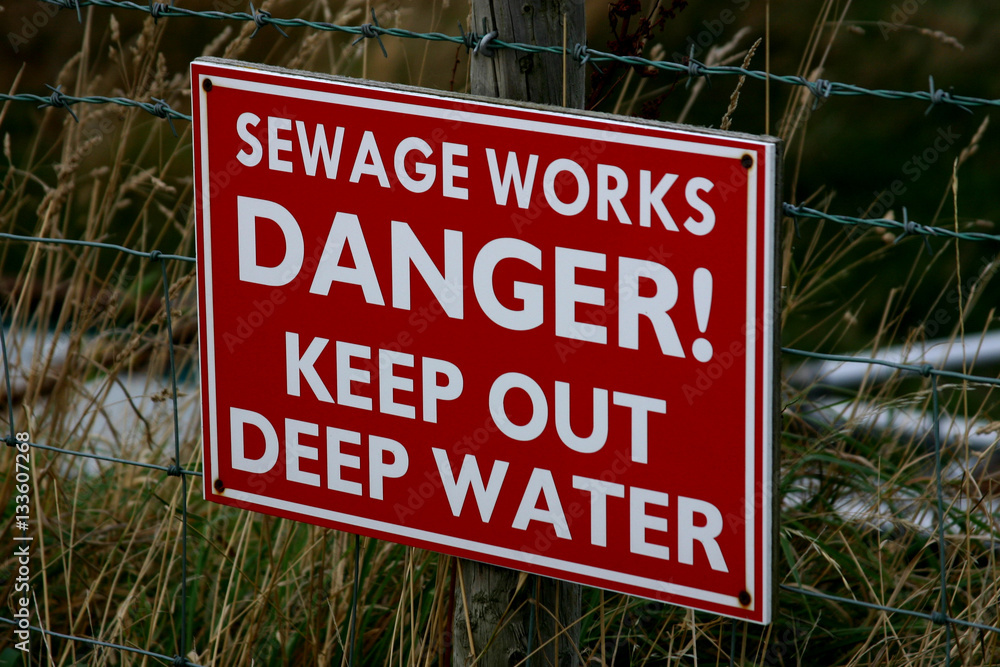 Sewage works deep water warning sign.