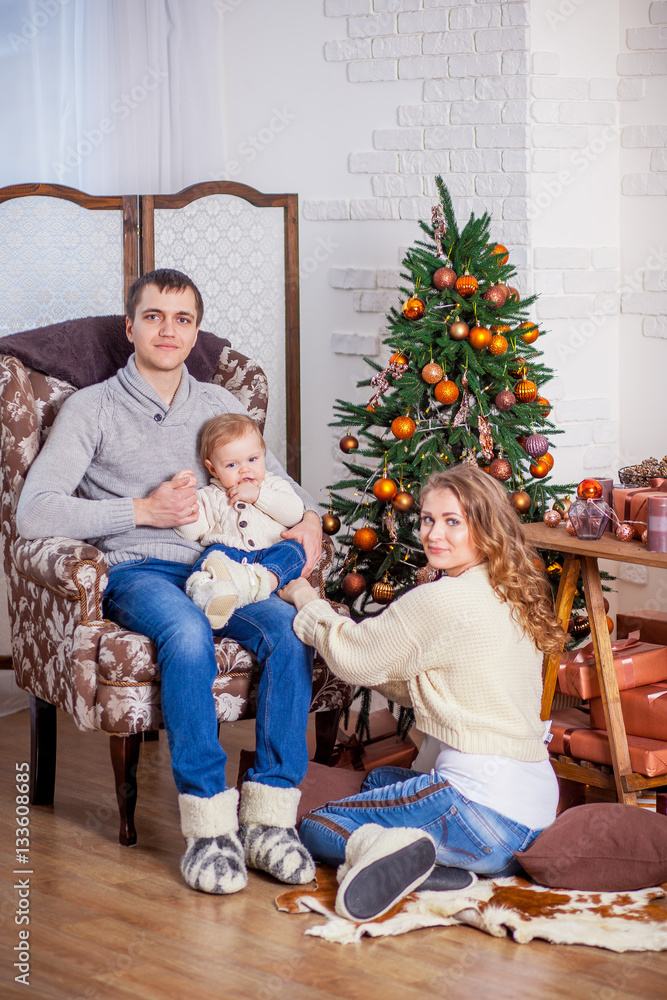 Happy family in jeans sitting xmas tree anticipation new year