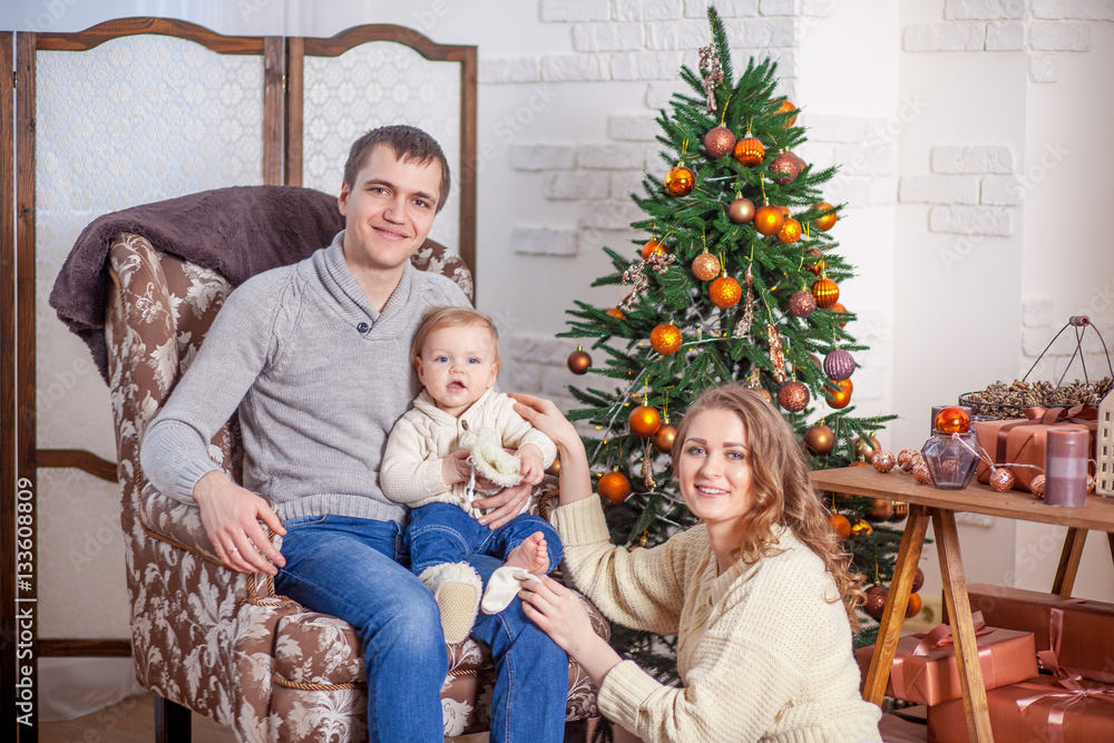 Happy family in jeans sitting xmas tree anticipation new year