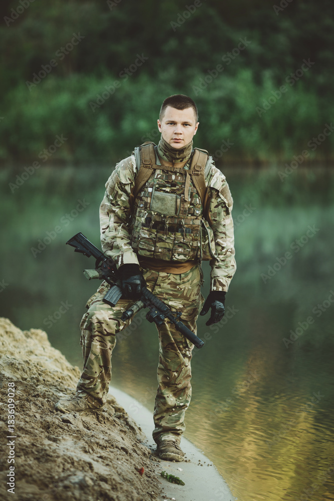 Fototapeta premium Special forces soldiers with weapon take part in military maneuv