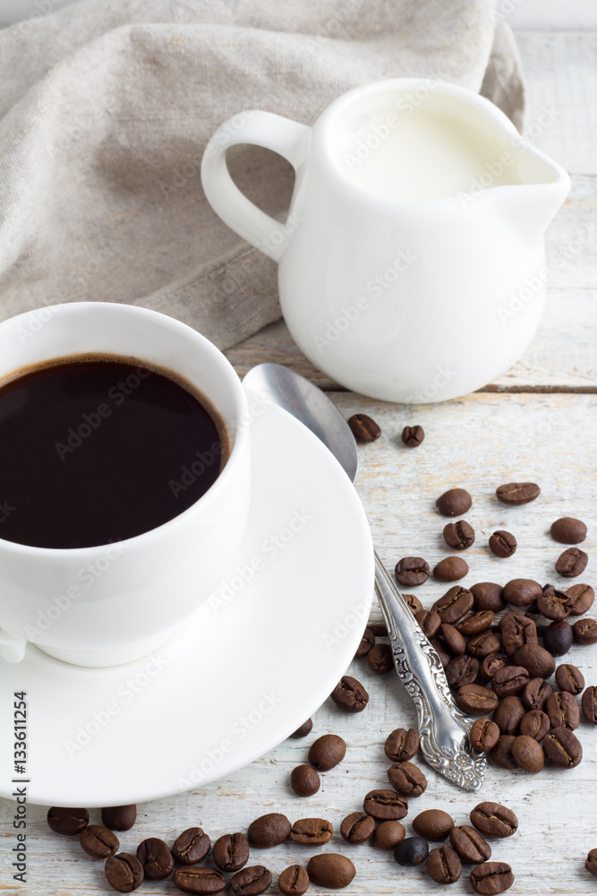 Black coffee in a white cup and coffee Black coffee in a white cup and coffee
