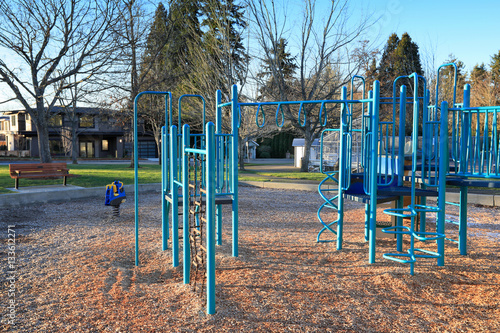 Children playground activities surrounded by green trees