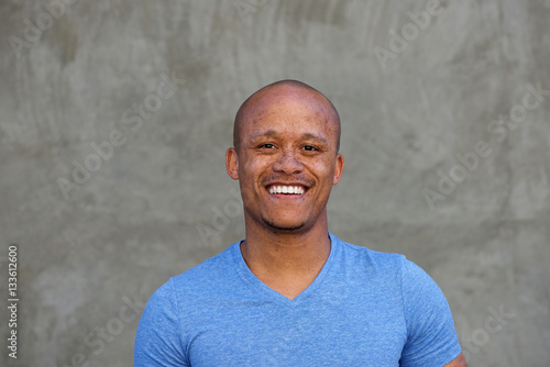 Close up mixed race man with freckles smiling