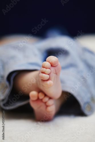 bare feet of newborn baby © Aliaksei Lasevich