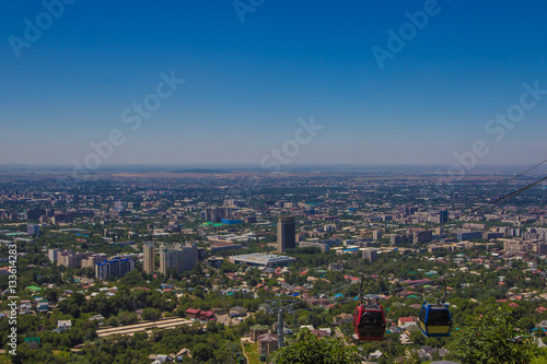 Almaty city view from Koktobe hill and cabin of cable car, Kazak photo