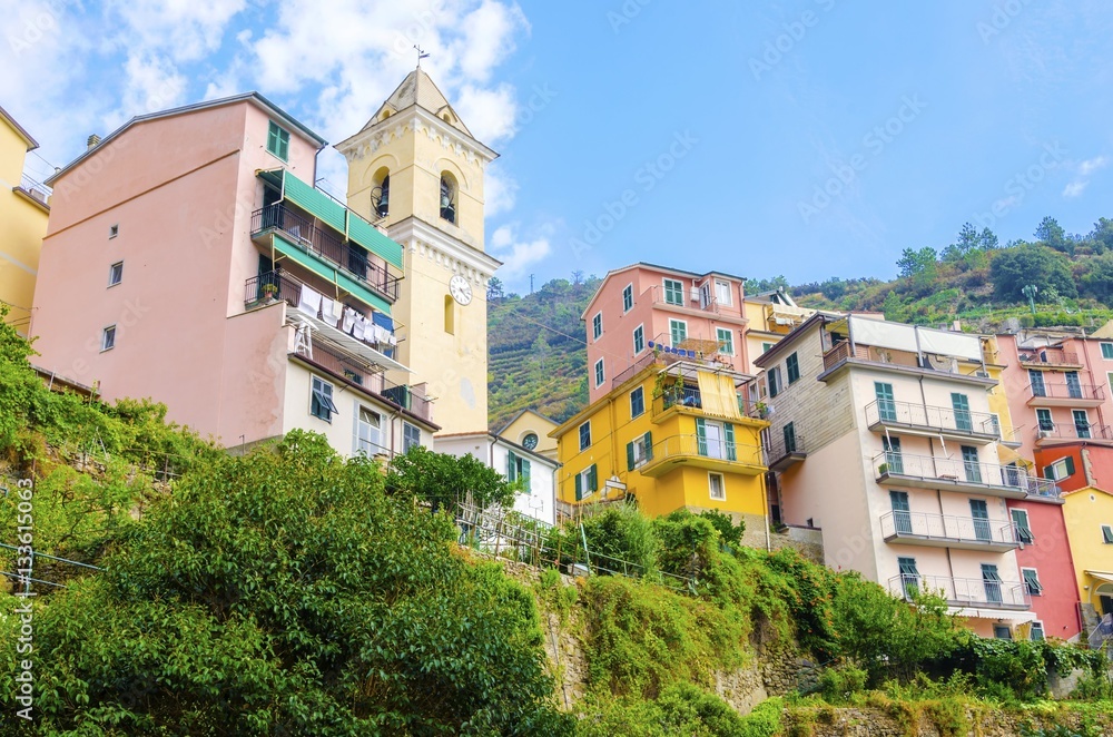 Manarola town, Riomaggiore, La Spezia, Liguria,northern Italy. The colourful houses on hills and San Lorenzo defence bell tower. Part of the Cinque Terre National Park and a UNESCO World Heritage Site