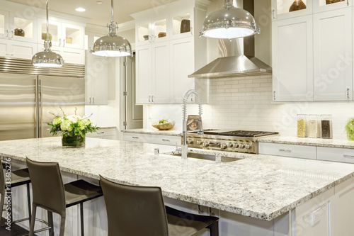 White kitchen design in new luxurious home photo