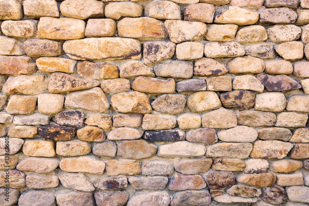 background and texture of granite stone wall surface.